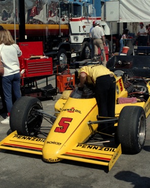 Mechanic working on Al Unser Sr.'s  Penske March 85C